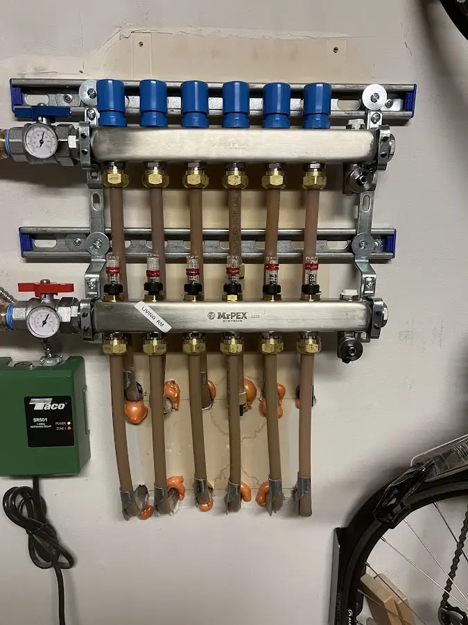 Plumber performing Water Heater Repair at a residential property in New Berlin