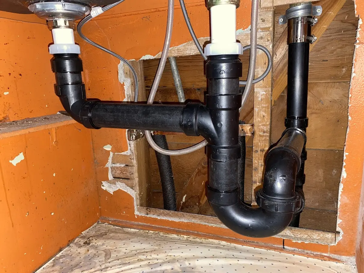 Professional Garbage Disposal Repair equipment and tools on the job in New Berlin